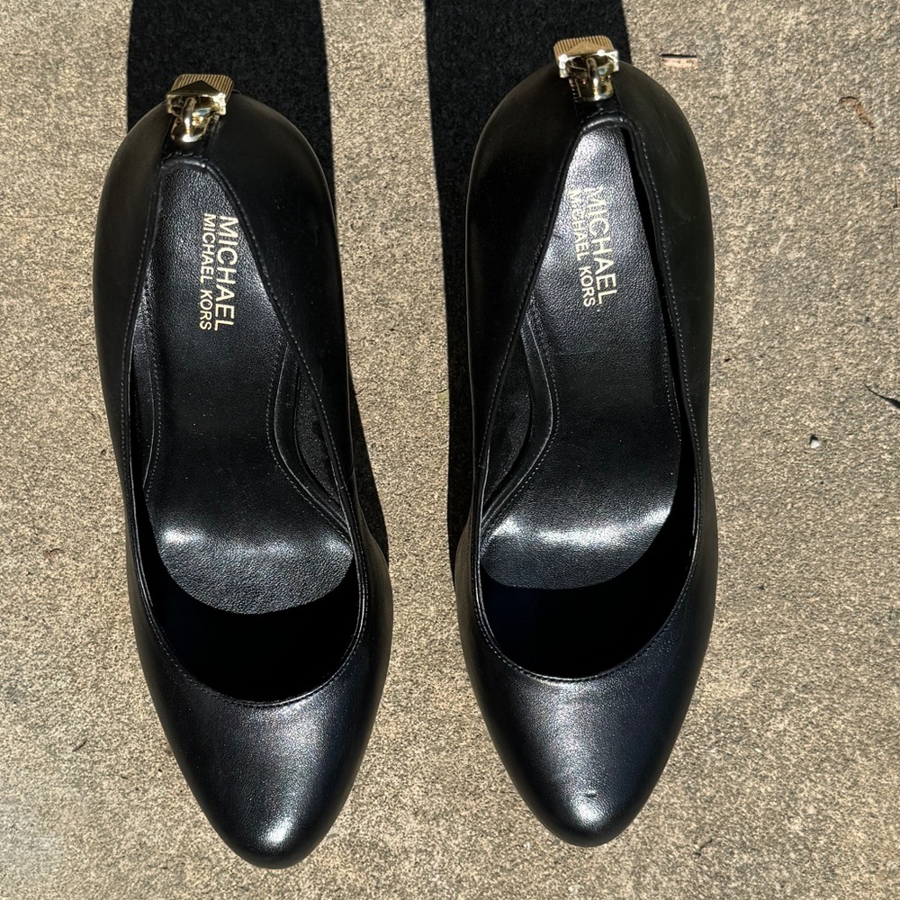 Michael Kors black leather heels with gold accent on heels.
